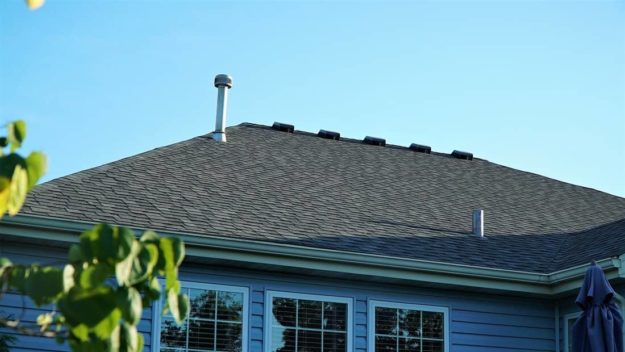 Three windows in a blue wall.