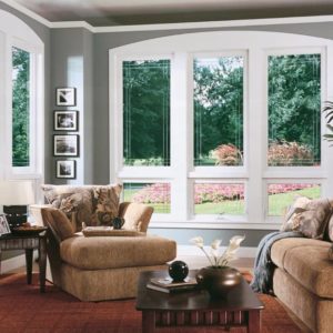 Picture windows decorate a living room