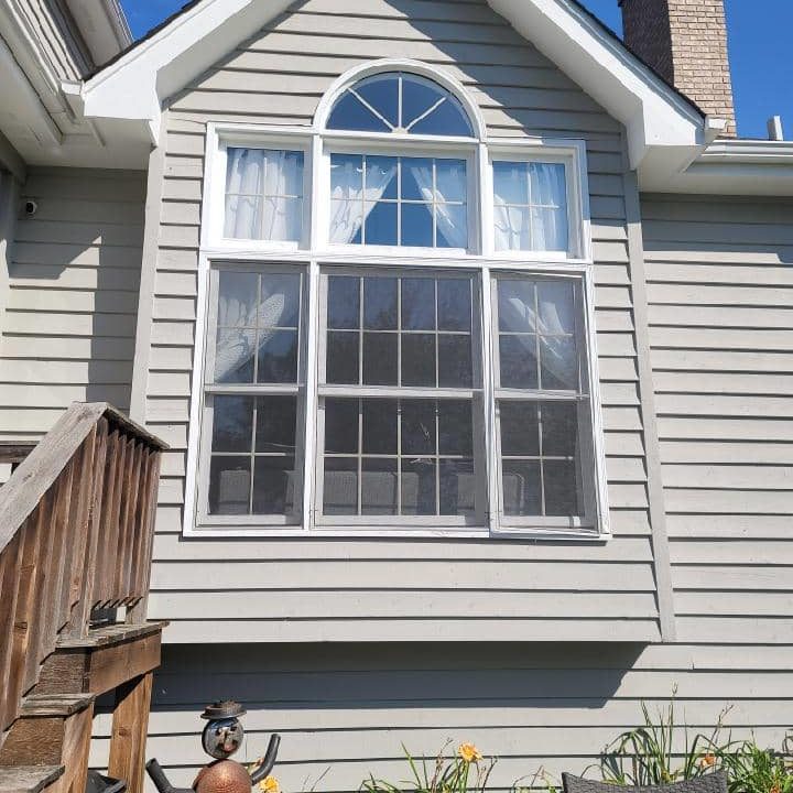 An old-fashioned set of windows begins to fade.