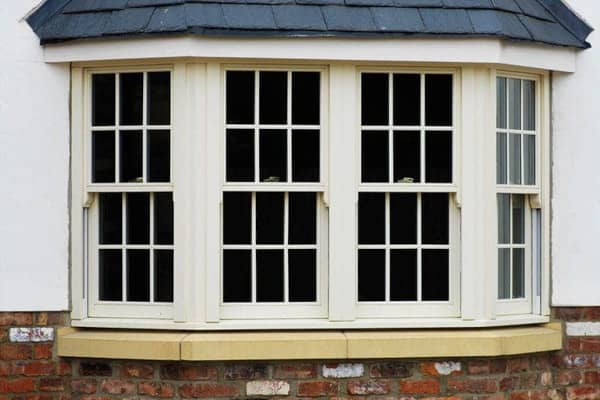 A bow window with multiple double hung windows for ventilation