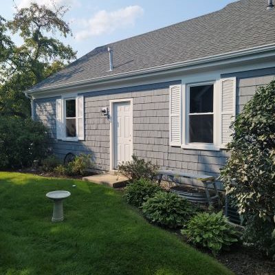 Two new double hung windows on the back of the house