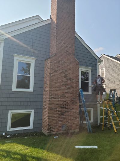 Worker completing window installation in Crystal Lake, IL