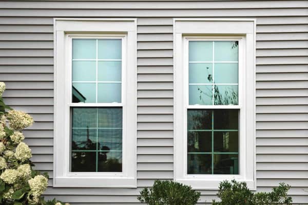 Two double hung windows on a home