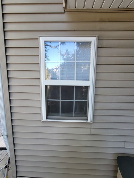 This double hung window approaches a corner gutter.