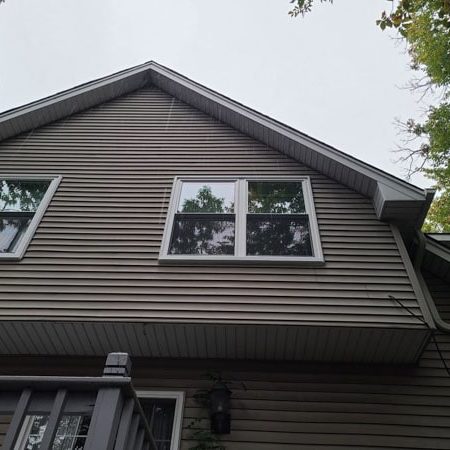 Two sets of windows on a home.