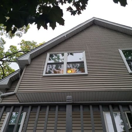 Evenly-spaced windows on a top floor.