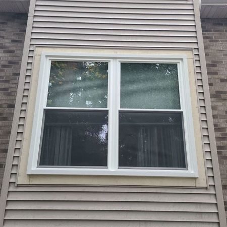 Windows complement a brick facade.