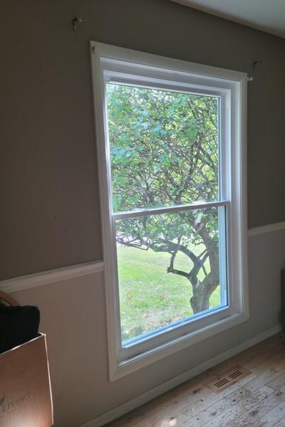 This double hung window invites light into the room.