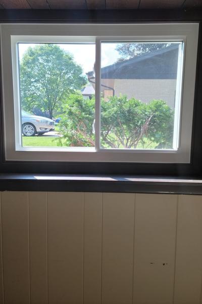 This egress window has a white frame.