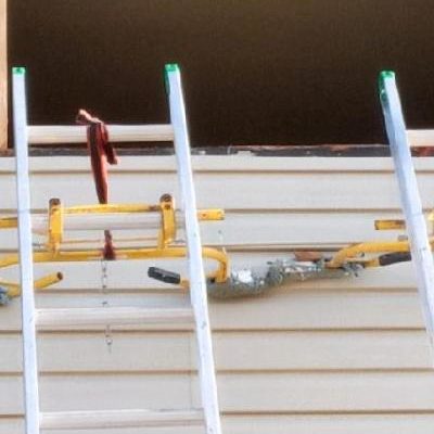 Ladders against an opening in a home