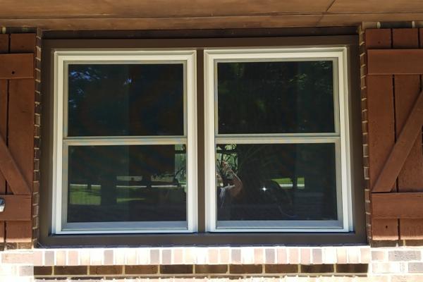 Two white double hung windows