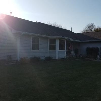 The front of this home contains many windows