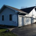 In this picture, we place new siding along a home