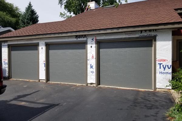 In this picture, we're about to weave siding among three garage doors in Grayslake, IL