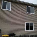 A tan home with new sliding windows in Lake in the Hills, IL