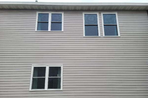 Three pairs of white windows grace a home