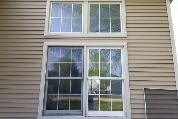 Two picture windows and two double hung windows are present in this picture