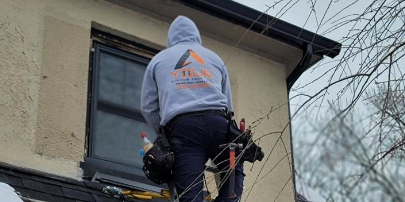 Representative from a windows company working on a home near me