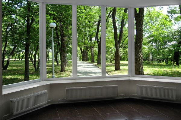 Large picture windows show gorgeous outdoor view