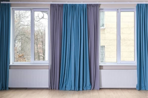 Living Room windows framed by blue curtains