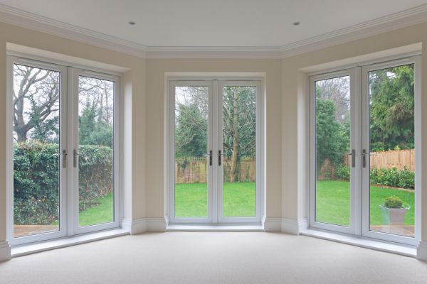 A bay window configuration using all glass doors