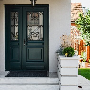 New Front Door On House Black front door with decorative iron on door windows